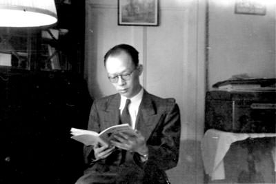 Zhou Yougang reading a book in 1949